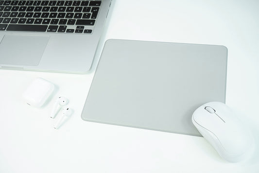 A white mouse on a mousepad