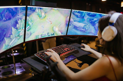 Close up of a person playing a game on their gaming setup.
